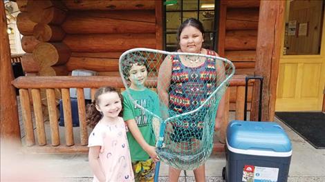 Jace Knapp caught this nice lake trout. Standing with him are Lilith Knapp and Christine Woodcock.