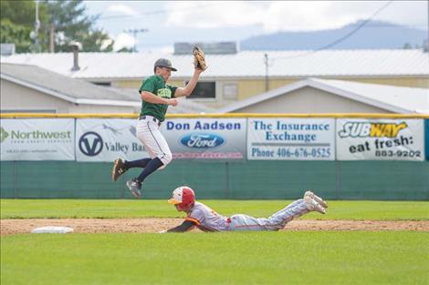 Mariner Eric Dolence snags a high throw out of the air and tags out the runner.   