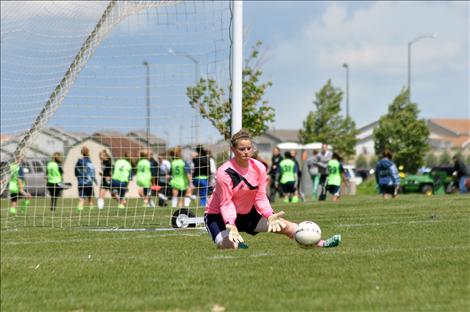 14U youth soccer goalie Jenna Evertz makes a save.