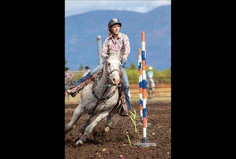 aden Fitzpatrick held on for a third-place 60-point ride during a high school rodeo bull riding event on Sept. 14, 2019 at the Polson Fairgrounds. 