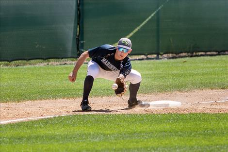 Senior Eric Dolence makes the play for an out.