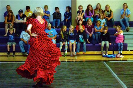 Connie Adams of Missoula’s Downtown Dance Collecticve taps a tango for the students.
