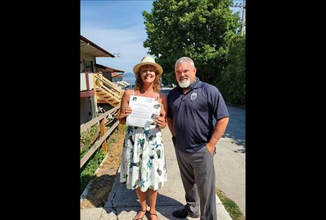 Kristyn Siciliani accepts an awards from Polson Police  Department Chief Wade Nash.