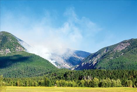 Crews work to  suppress flames on  the Finley Lake Fire   Sunday afternoon. 