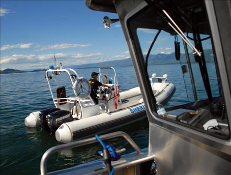 Deputy Becky McClintock drives the older Lake County Sheriff’s Office rescue boat.