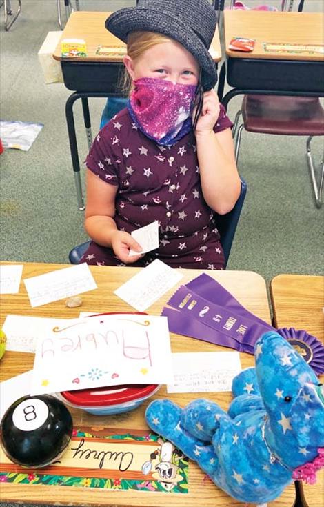 A Polson second-grade student wears a mask in class.