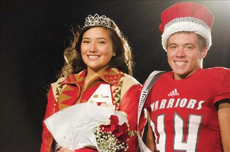 Arlee Homecoming Queen Halle Adams and King Colt Crawford pose for a photo.