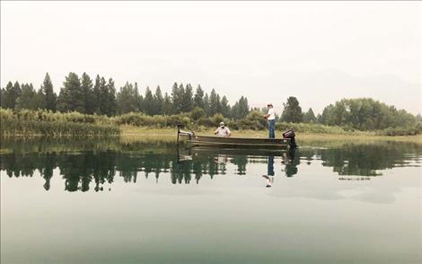 Fishermen angle for bass on the Flathead River near Dixon. 