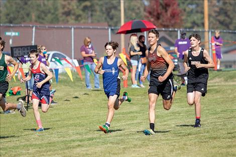 Bulldog Zoran LaFrombois and Chief Zarec Couture run in the Mission Shadows cross country meet.
