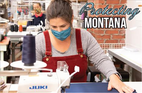 CarolLynn Lapotka and Alyssa Kennamer sew masks together at the REcreate Designs studio in downtown Polson. 