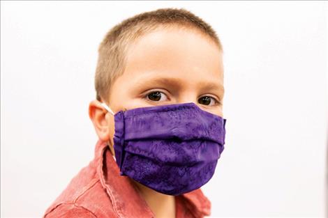 Johnny Lapotka models a mask. 