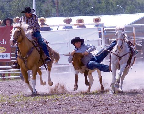 Shane Morigeau, Dixon, bulldogs a steer at the Arlee rodeo on the Fourth of July. He was competing in honor of his granfather, Doug Morigeau.  