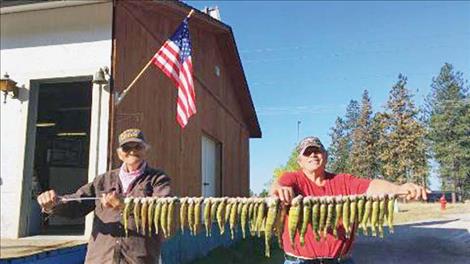 The Macman, right, displays the catch of the day. 