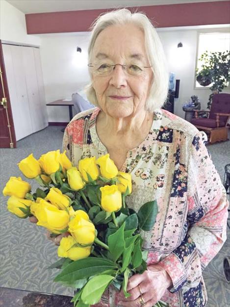 Maureen Theiler celebrates her 82nd birthday last April with yellow roses.