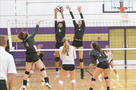 The Charlo Lady Vikings battle at the net during Western C divisional action