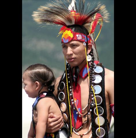 Louie Paul and his son wait for the grand entry at the Arlee Celebration. 