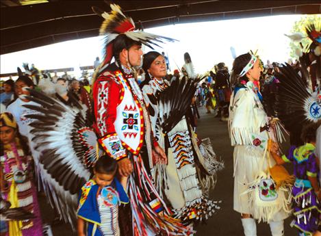 Families stand in line together at the 115th Arlee Celebration as they wait for the grand entry.