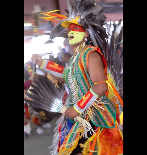 Dancer Douglas Pierre looks for an opening in the dancing crowd at the Arlee Celebration.