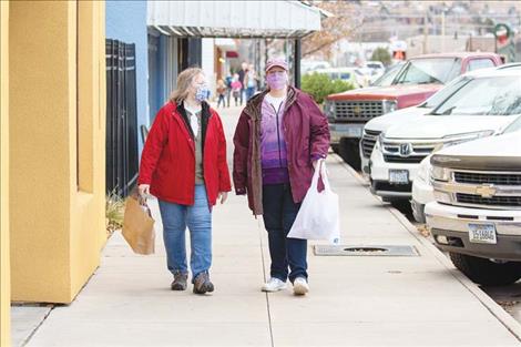 The sidewalk along Main Street in Polson was bustling with shoppers during the Small Business Saturday event.