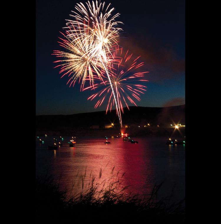 Fireworks light up the night — and the Flathead River in Polson July 4. Donations from businesses and individuals made the spectacular and well-attended display possible.