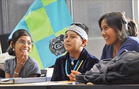 Students Charmayne, Natani and Irvilinda have fun working a problem in the documentary film “Navajo Math Circles,” which will be shown during the FLIC event in January. 