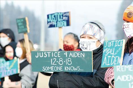 Family and friends of Aiden Finely seek justice for him on the two year anniversary of his death. Georgi Mitchell, Aiden’s grandmother, holds a sign above, center. On December 8, 2018, Aiden’s family was told by a highway patrol officer that he was struck and killed by a motorist who didn’t stop or report the incident.