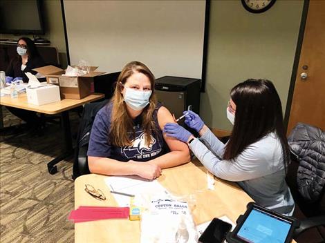 Dr. Kelly Bagnell receives her first COVID-19 vaccination at St. Joseph Medical Center in  Polson.