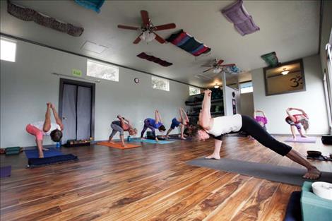 Bonnie Kiser leads a yoga class in Polson.