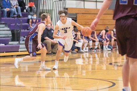 Charlo Viking Phil Marquez races to the hoop.