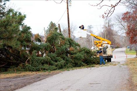 Mission Valley Power crews work at one of the locations causing power outages. 