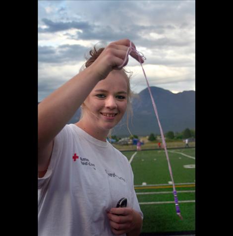 Sarah Anderson earns a bead for each lap she makes around the track.