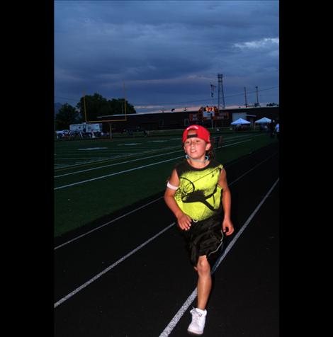 Cmomo Peone, 9, runs in honor of his uncle.