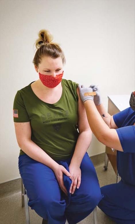 Nurse Natasha Balderas gets her second dose of the COVID-19 vaccine.