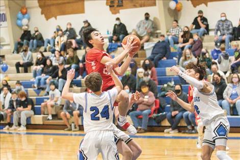 Arlee Warrior Levi Fullerton glides to the hoop for a score. 