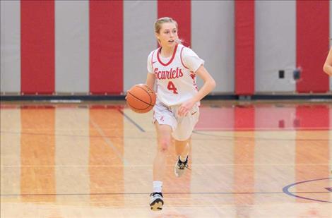 Arlee Scarlet Raven Parson searches down court for an open teammate.