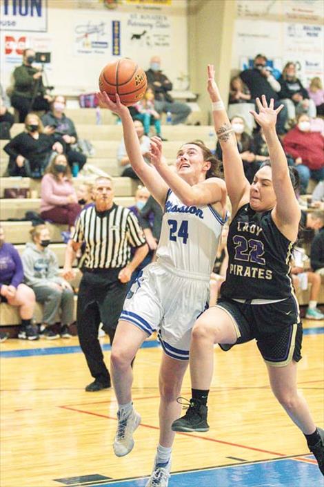 Mission Lady Bulldog Sydney Brander drives to the hoop for a score