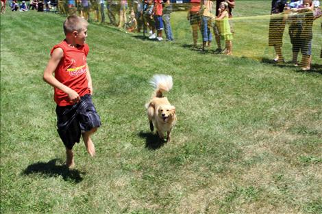 Dog races test the speed of man’s best friend, with prizes for the fastest this weekend at Good Old Days in St. Ignatius.