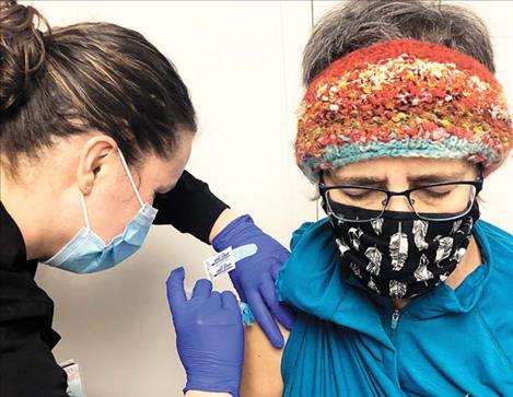 Kristi Niemeyer receives her first dose of the COVID-19 vaccine.