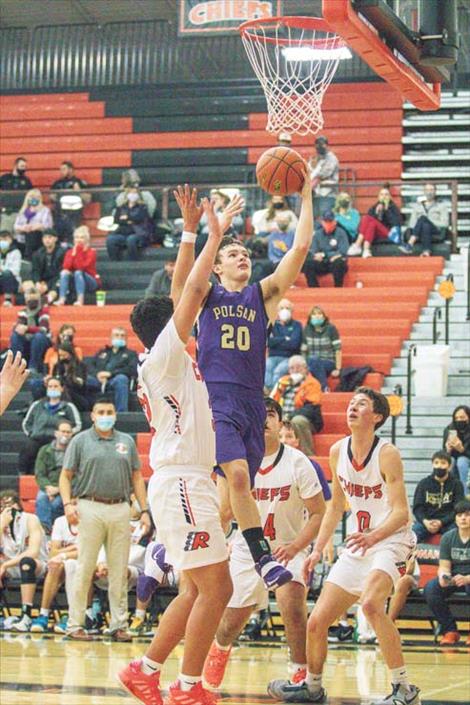 Polson Pirate Jarrett Wilson slips past Ronan defenders for a score.