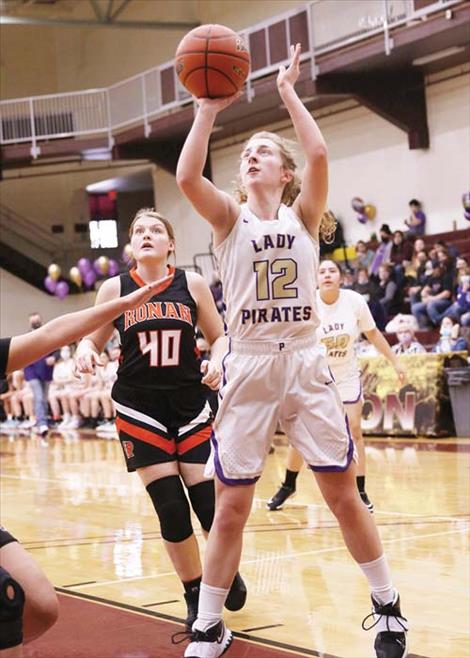 Polson Lady Pirate Jazlyn Dalbey sinks a shot for a score.