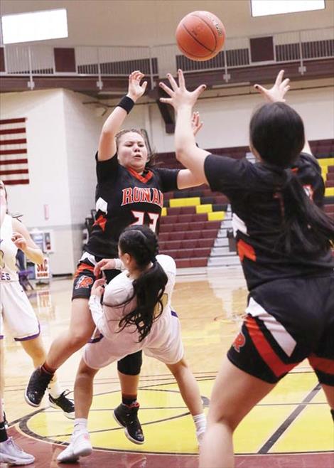 The Polson Lady Pirates and Ronan Maidens battle in the paint.