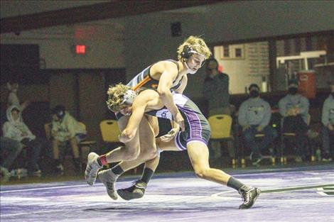 Polson Pirate Maysn Cowell and Ronan Chief Trevor Bartel battle in the 126 weight class.