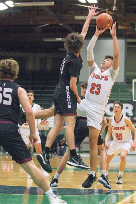 Ronan Chief Leonard Burke shoots a jumper over a Maroon defender.