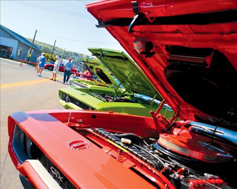 The Valley Cruisers’ Cruisen By The Bay annual car show drew more than 1,000 participants and spectators to Polson. This row of Plymouth GTXs and Roadrunners was a magnet for fans of the cars .