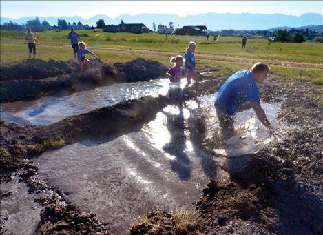 The Korella family runs through a deceptively tricky mud bog.