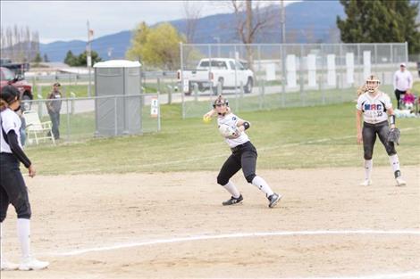 MAC third baseman Izzy Evans snags a grounder and throws the runner out.