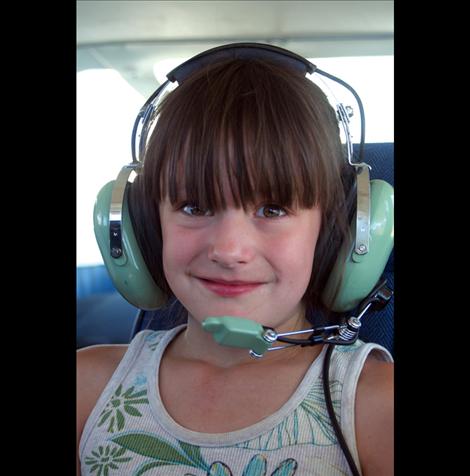 Arleta Long was one of several younsters who got a plane ride through the Young Eagles program during the Fly In last weekend in Mission.