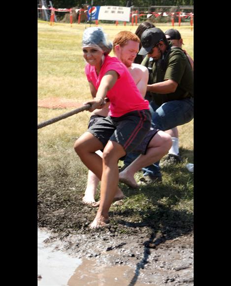 Mrs. Montana Alyssa Schock jumped into the muddy tug-of-war during Good Old Days Saturday in St. Ignatius.