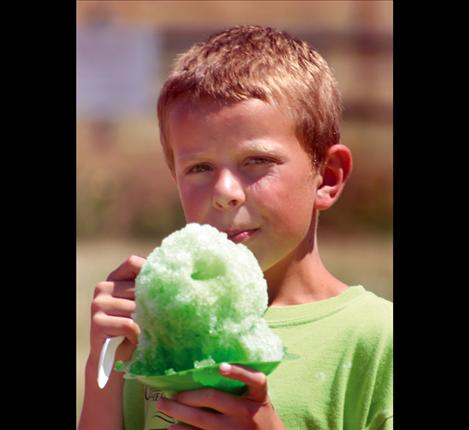 Snow cones kept folks cool and hydrated during the heat of the day as temperatures peaked near 96 degrees.