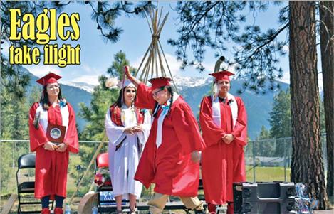 Two Eagle River School students celebrate graduation day.